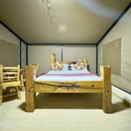 Twin bed setup in a luxury tent at Olorien Mara Camp, Masai Mara, Kenya.