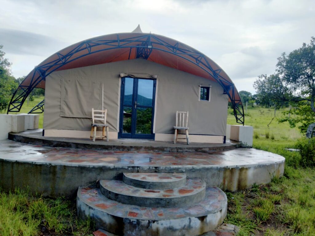 Luxury safari tent with private balcony at Olorien Mara Camp, Masai Mara, Kenya.